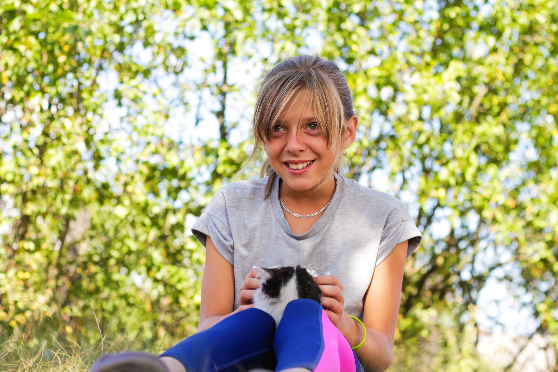 Defocus,Little,Surprised,Girl,Playing,And,Caress,Cat,,Black,And